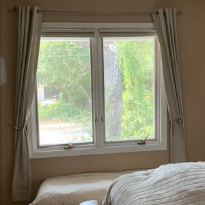One set of tan/beige curtains